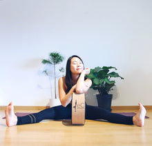 Load image into Gallery viewer, Smiling asian yogini with cork yoga wheel