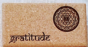 Close-up Cork Yoga Block with Yantra and "Gratitude" inscripstion